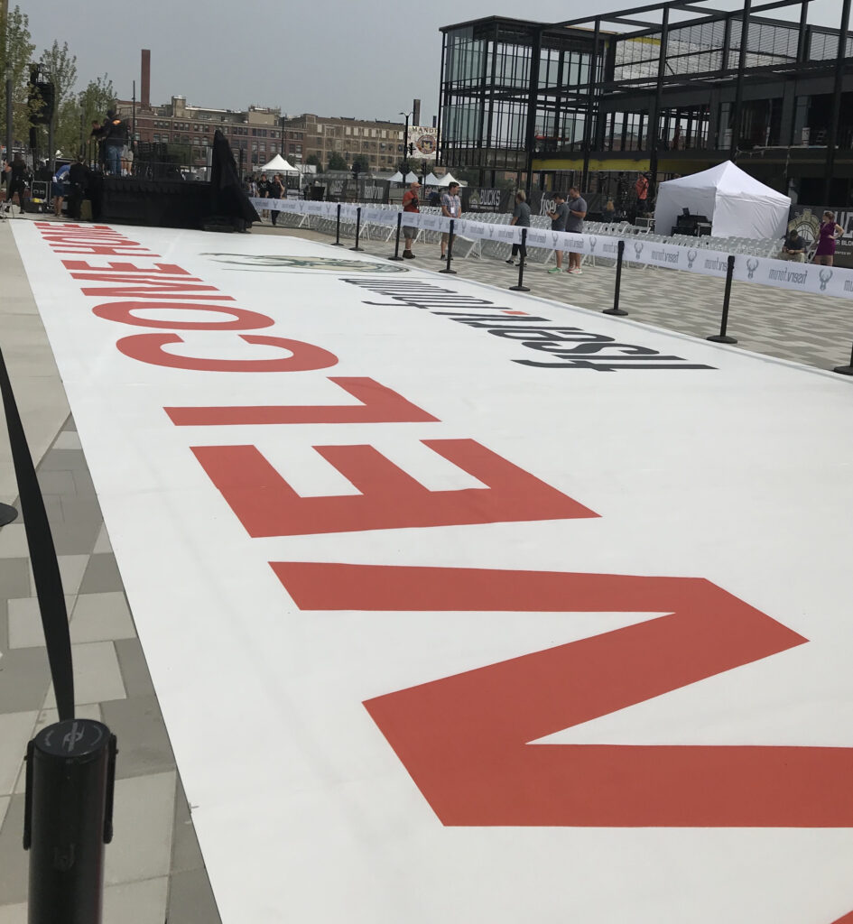 Bucks Welcome Mat - Mandel Logo in Background